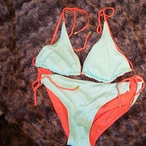 Swim suit reversible orange and blue